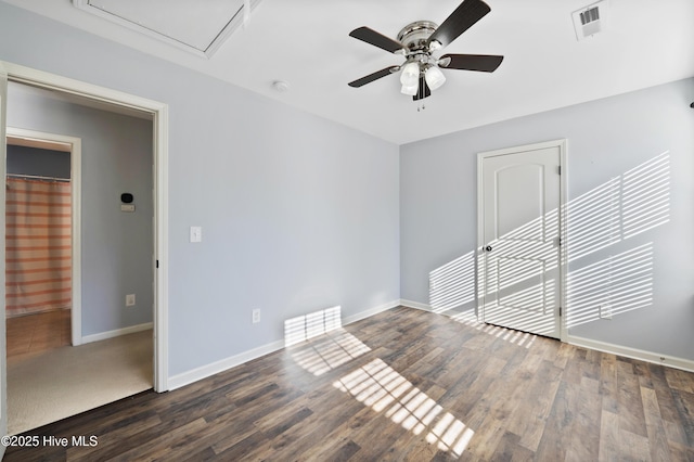 unfurnished room with ceiling fan and dark hardwood / wood-style floors