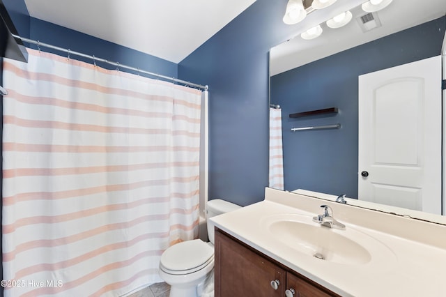 6507 Rustling Leaves Way, Wilmington, NC 28409 - bathroom featuring toilet, vanity, and a shower with curtain