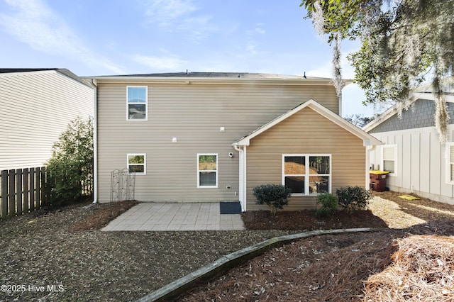 back of property with a patio