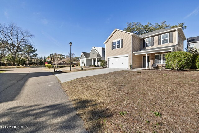 6507 Rustling Leaves Way, Wilmington, NC 28409 - traditional home featuring driveway, an attached garage, and a porch