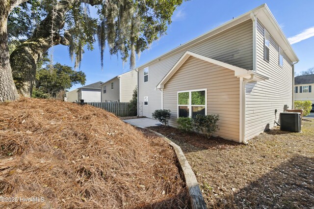 6507 Rustling Leaves Way, Wilmington, NC 28409 - back of property with central AC