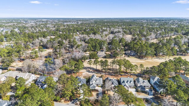 6507 Rustling Leaves Way, Wilmington, NC 28409 - aerial view of property and surrounding area featuring nearby suburban area and a tree filled landscape