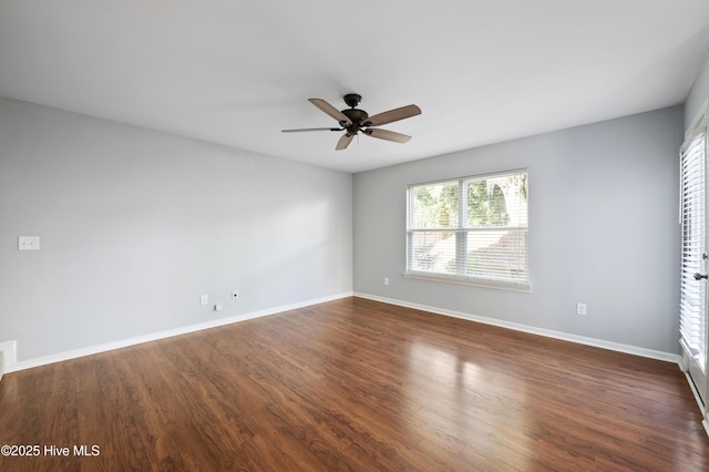 6507 Rustling Leaves Way, Wilmington, NC 28409 - spare room featuring a ceiling fan, baseboards, and dark wood-type flooring