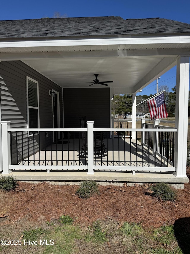 view of patio with a ceiling fan and fence