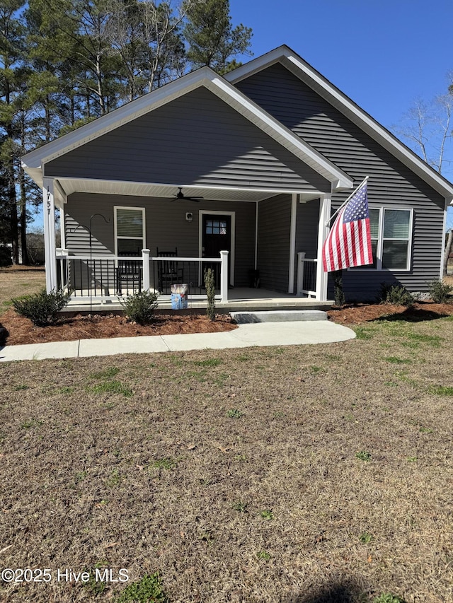 view of front of home featuring a porch and a front lawn