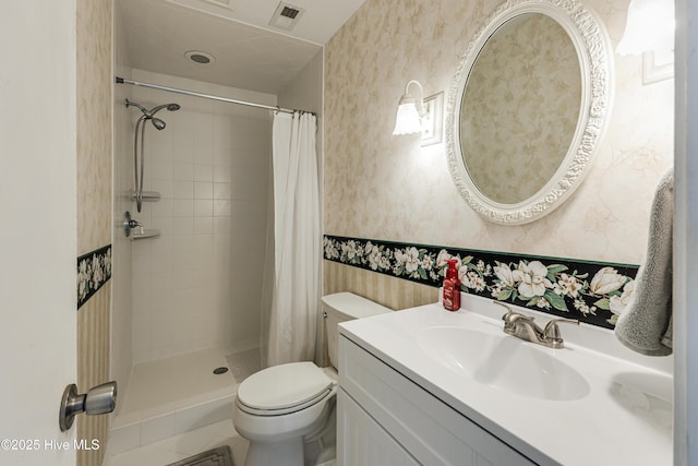 bathroom featuring wallpapered walls, visible vents, a stall shower, and toilet