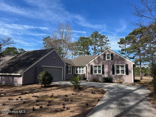 view of front of property featuring an attached garage and driveway