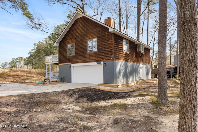 view of side of home with a garage