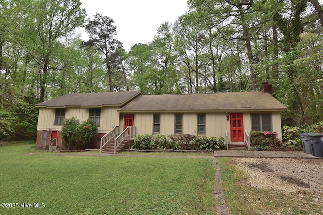 ranch-style home with a front lawn