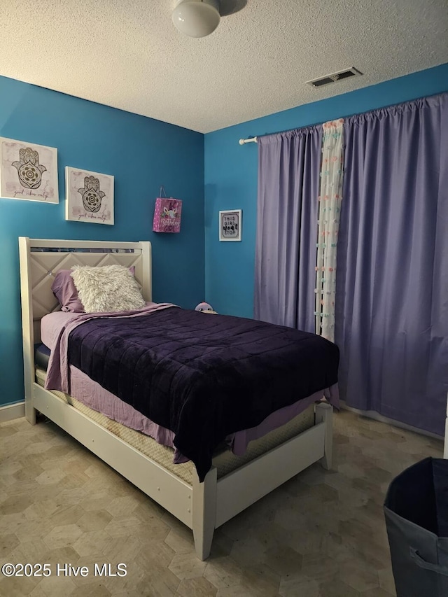 bedroom with a textured ceiling