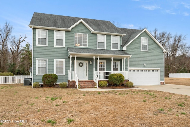 colonial inspired home featuring a porch, concrete driveway, fence, a garage, and cooling unit