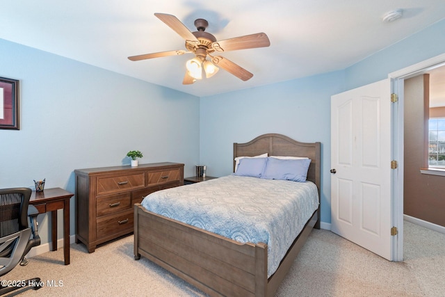 bedroom featuring a ceiling fan and baseboards