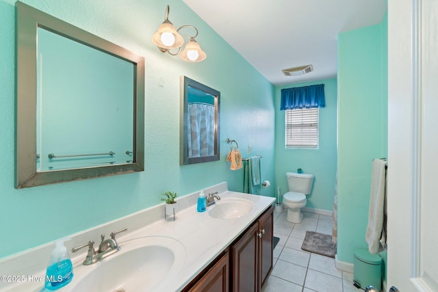 full bathroom featuring double vanity, tile patterned flooring, visible vents, and a sink