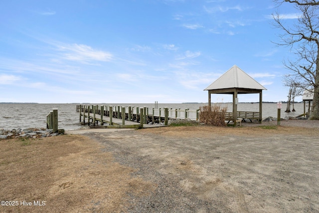 exterior space featuring a water view and a boat dock