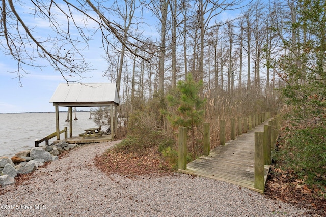 dock area featuring a water view and boat lift