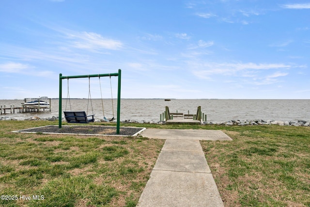 view of yard featuring a boat dock and a water view