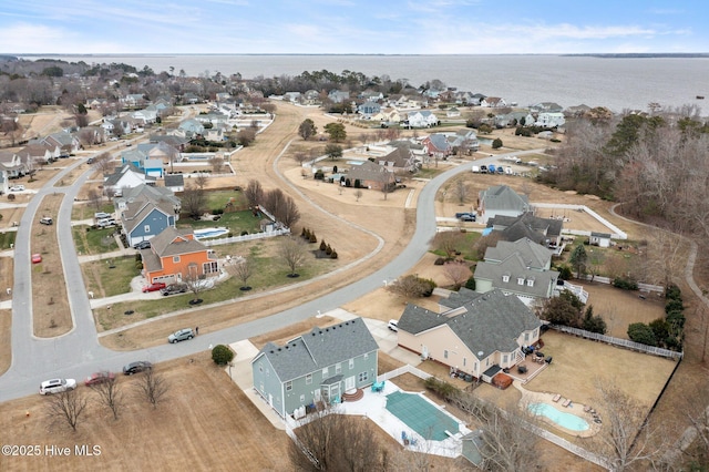 aerial view with a water view and a residential view