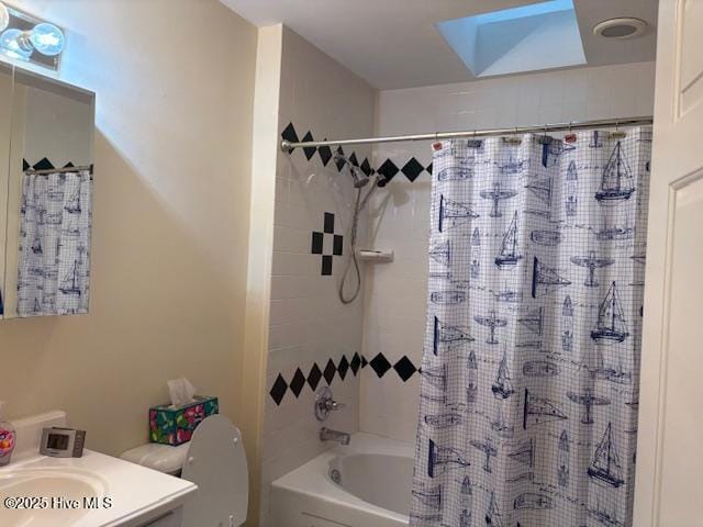 full bathroom featuring vanity, toilet, and shower / bath combination with curtain