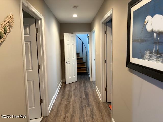 hallway featuring dark wood-type flooring