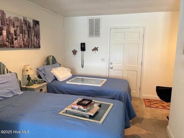 carpeted bedroom with a textured ceiling