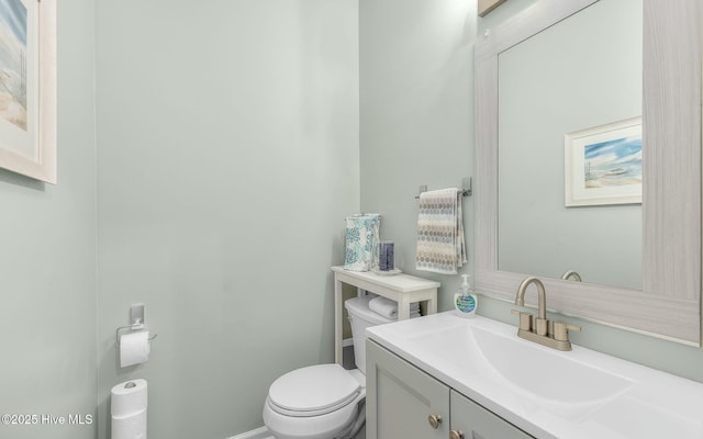 bathroom with toilet and vanity