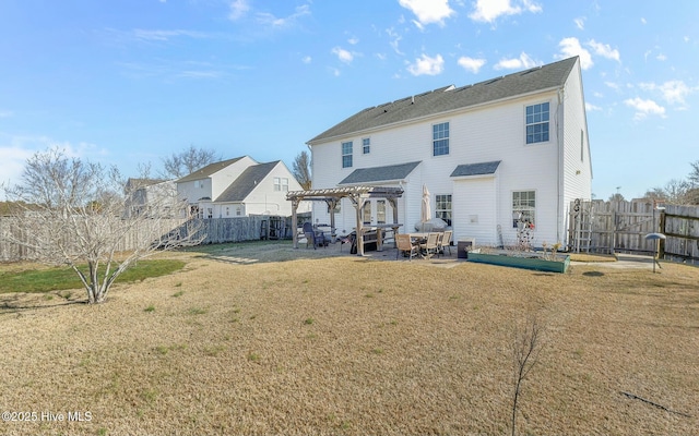 back of property with a lawn, a patio area, a fenced backyard, and a pergola