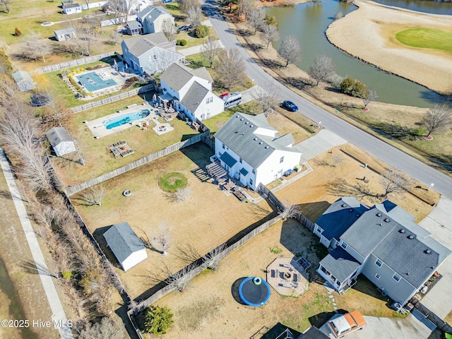 birds eye view of property featuring a water view and a residential view