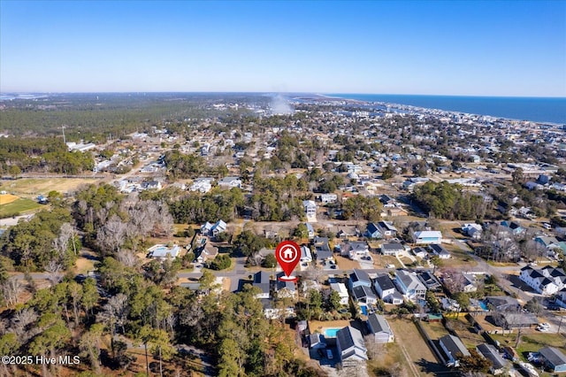 drone / aerial view with a water view and a residential view