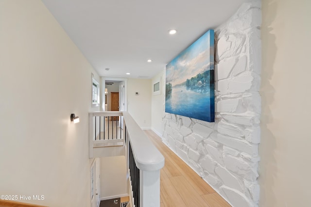 hallway with wood-type flooring