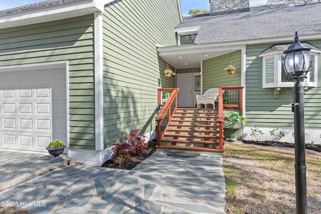 entrance to property featuring a garage