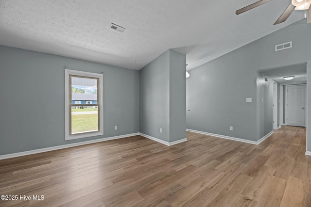 unfurnished room featuring visible vents, ceiling fan, baseboards, and light wood-style flooring