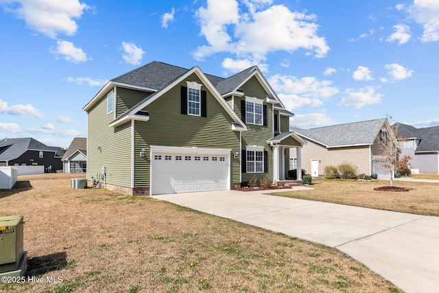 traditional-style house featuring a front yard, central AC, and driveway