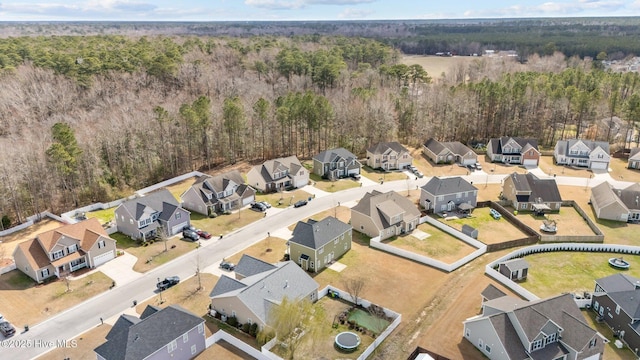 bird's eye view with a forest view and a residential view