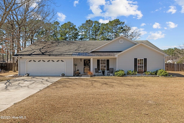 single story home featuring concrete driveway, covered porch, fence, a garage, and a front lawn