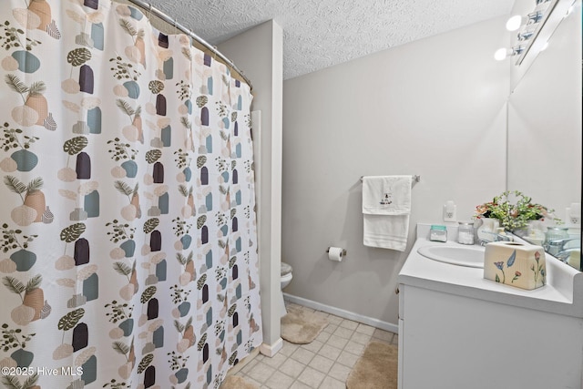 full bath with toilet, a textured ceiling, vanity, tile patterned flooring, and baseboards