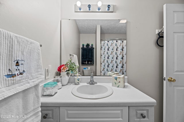 full bathroom with a shower with curtain, a textured ceiling, and vanity