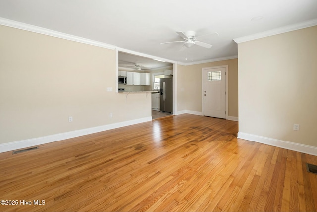 unfurnished living room featuring crown molding, ceiling fan, and light hardwood / wood-style flooring