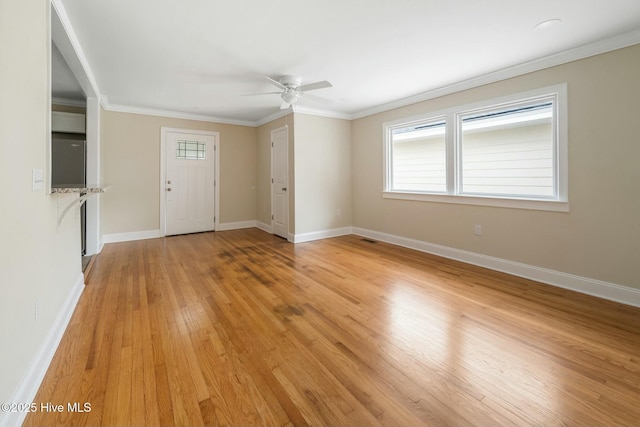 unfurnished living room with crown molding, ceiling fan, and light hardwood / wood-style flooring