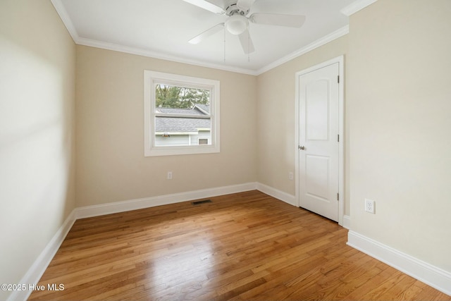 unfurnished room featuring ceiling fan, ornamental molding, and hardwood / wood-style floors