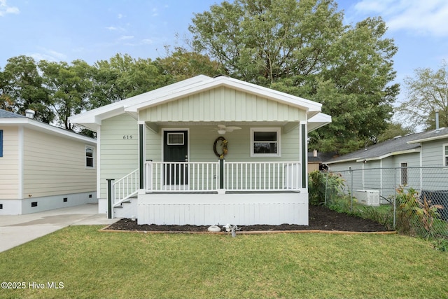 bungalow featuring a front yard and covered porch