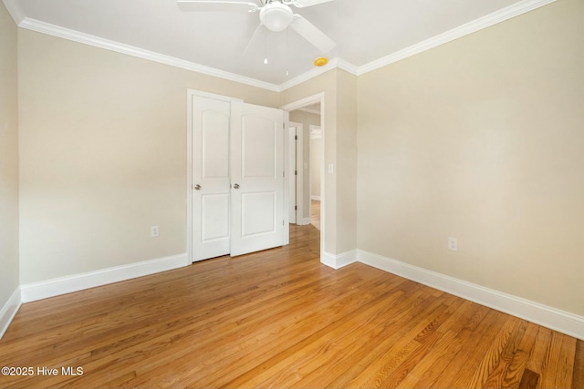 unfurnished bedroom featuring crown molding, ceiling fan, and light hardwood / wood-style flooring