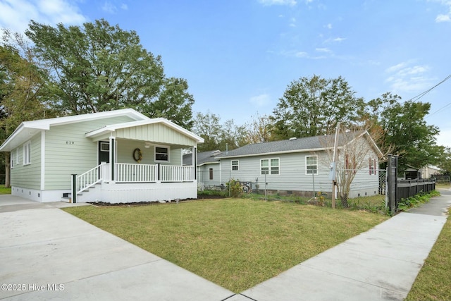 bungalow-style house with a porch and a front lawn