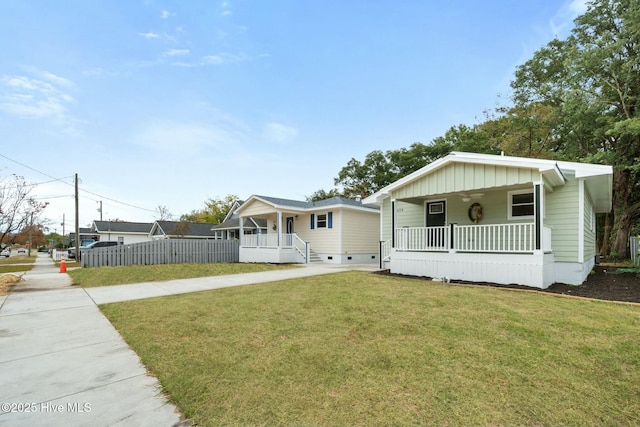 view of front of house with a front lawn and covered porch