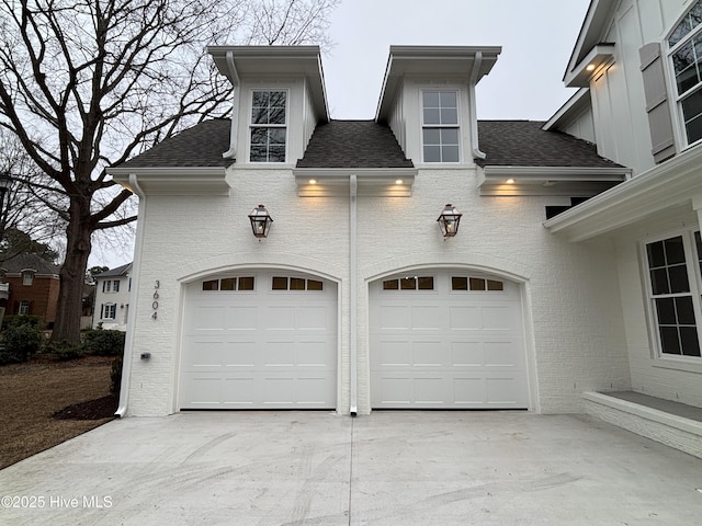 garage featuring driveway