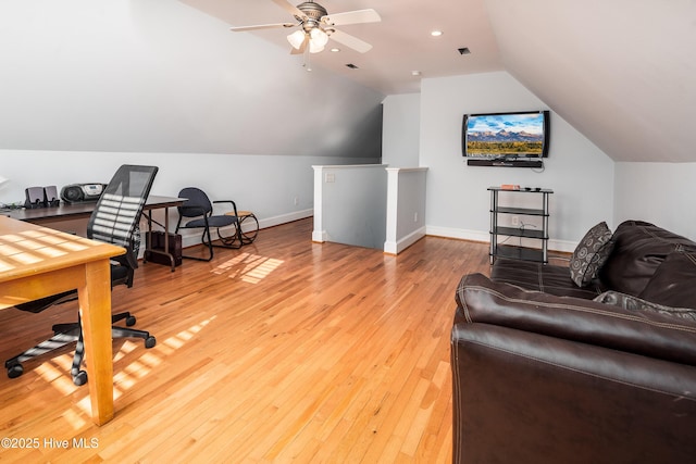 office featuring vaulted ceiling, light wood-type flooring, visible vents, and baseboards