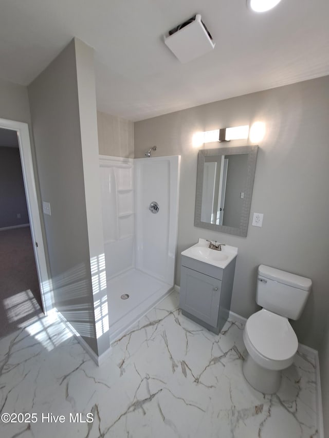 bathroom with vanity, toilet, and walk in shower