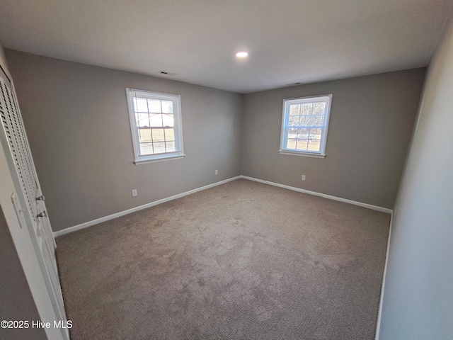 carpeted empty room featuring a healthy amount of sunlight