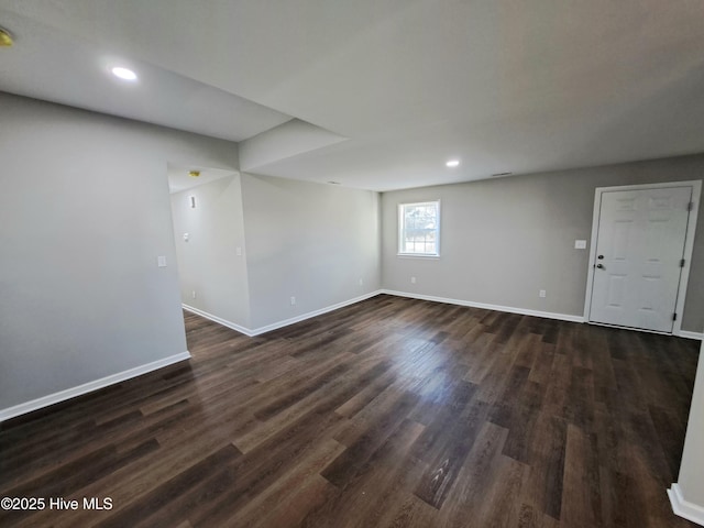 empty room featuring dark hardwood / wood-style flooring