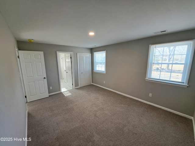 unfurnished bedroom with carpet