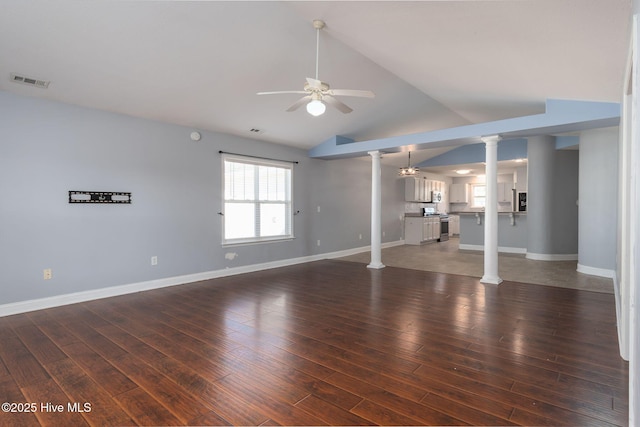 unfurnished living room with ceiling fan, lofted ceiling, dark hardwood / wood-style flooring, and decorative columns